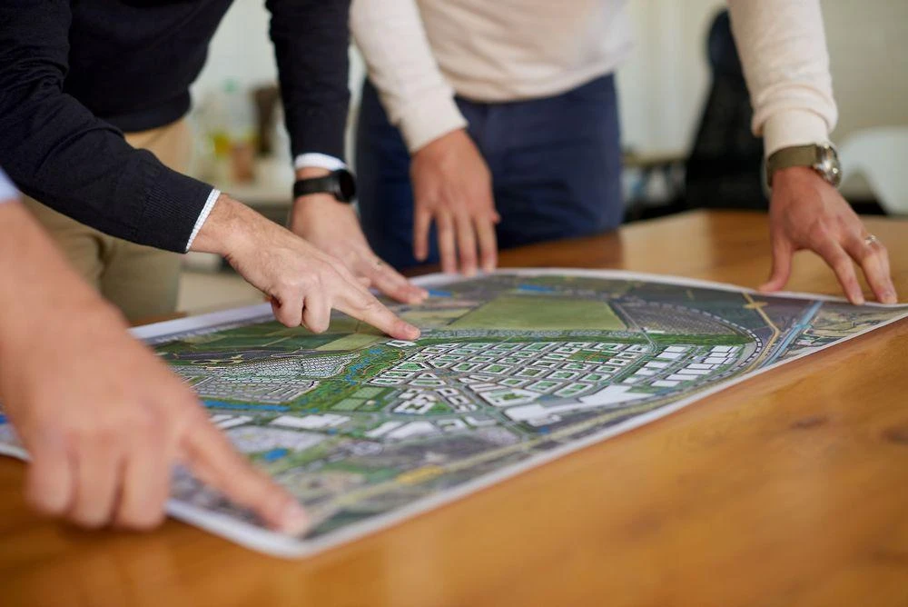 Urban planners reviewing a township master plan